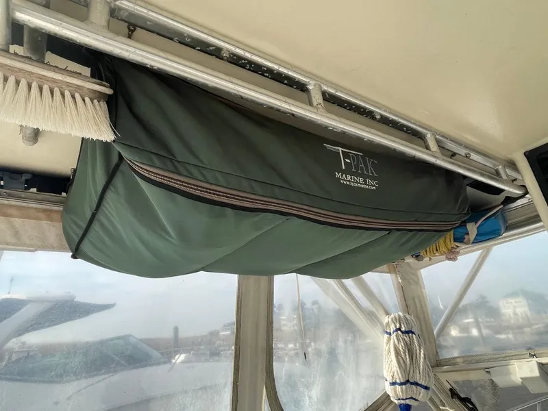 Slide: The Image of Green canvas cover on a 2003 Carolina Classic 28 boat, interior view. - 14