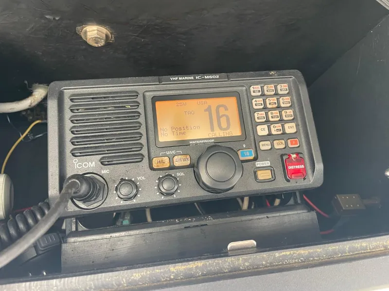 Slide: The Image of VHF marine radio in a 2003 Carolina Classic 28 boat dashboard. - 25