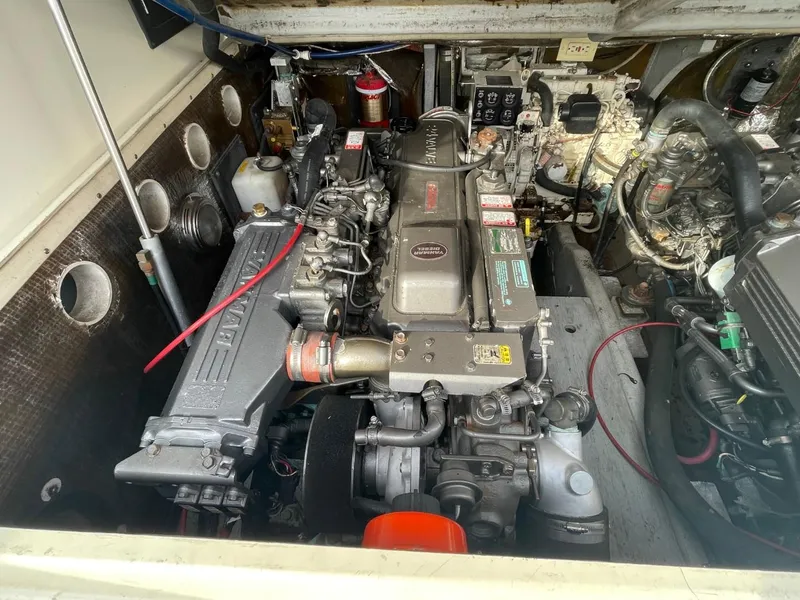 Slide: The Image of Engine compartment of a 2003 Carolina Classic 28 boat, showcasing detailed mechanical components. - 28