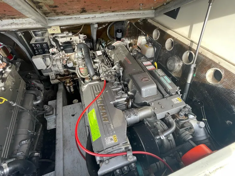 Slide: The Image of Engine compartment of a 2003 Carolina Classic 28 boat, showcasing detailed machinery. - 29
