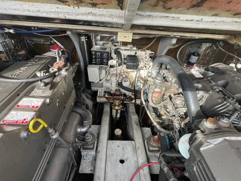 Slide: The Image of Engine compartment of a 2003 Carolina Classic 28 boat, showcasing detailed mechanical components. - 30