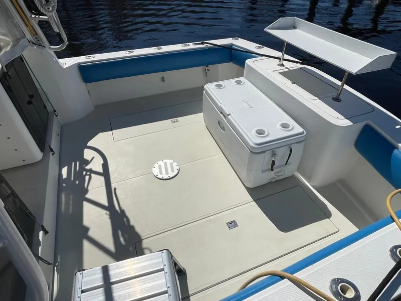 Slide: The Image of 2003 Carolina Classic 28 boat deck with cooler and fishing station. - 37