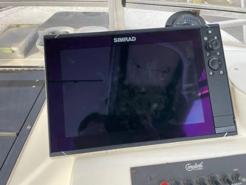 Slide: The Image of Simrad display on 2003 Carolina Classic 28 boat dashboard. - 7