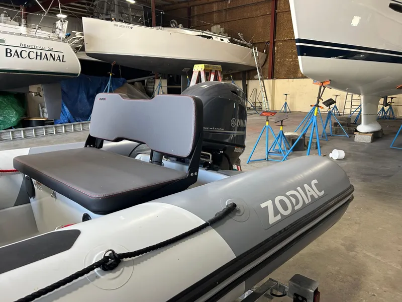 Slide: The Image of 2025 Zodiac Open 4.2 inflatable boat in a marina workshop setting. - 4