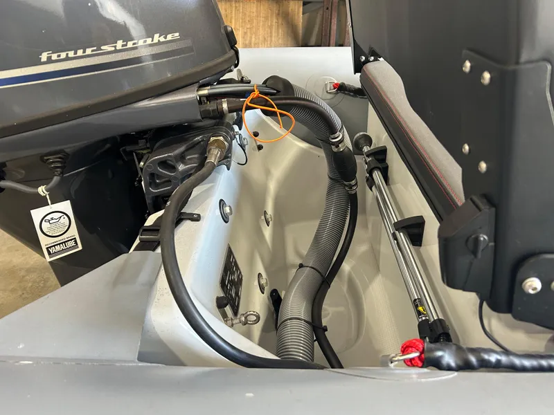 Slide: The Image of Zodiac Open 4.2 boat engine compartment, featuring a four-stroke motor, 2025 model. - 8