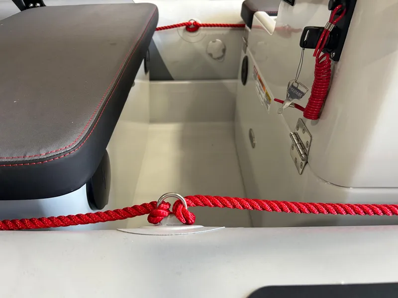 Slide: The Image of 2025 Zodiac Open 4.2 boat interior with red rope and seating detail. - 9