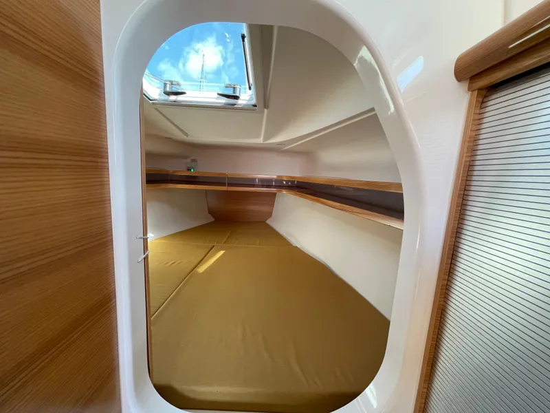 Slide: The Image of Interior cabin of 2021 Dragonfly 32 Evolution sailboat with skylight and wooden accents. - 16