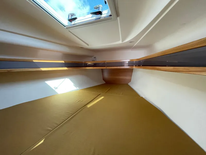 Slide: The Image of Interior cabin of 2021 Dragonfly 32 Evolution sailboat with skylight and wooden accents. - 17