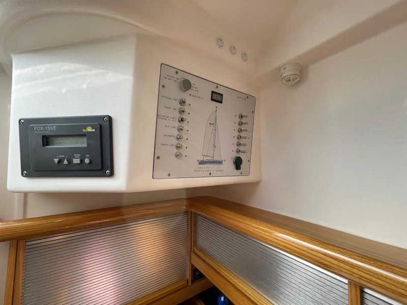 Slide: The Image of Control panel inside a 2021 Dragonfly 32 Evolution sailboat cabin. - 22