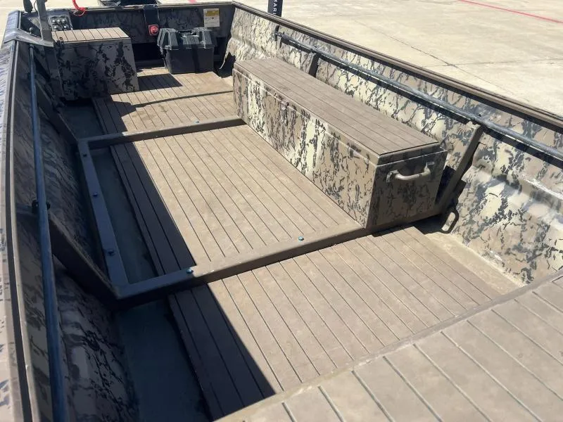 Slide: The Image of 2019 Pro-Line BTX 1848 boat interior with camouflage design and wooden flooring. - 10