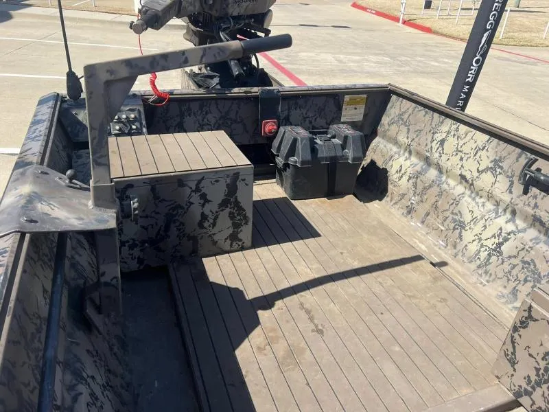 Slide: The Image of 2019 Pro-Line BTX 1848 boat interior with camouflage design and storage compartments. - 11