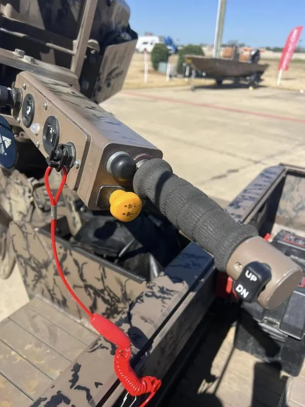 Slide: The Image of Close-up of Pro-Line BTX 1848 boat controls, featuring handle and switches, 2019 model. - 13