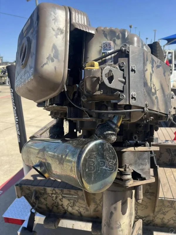 Slide: The Image of 2019 Pro-Line BTX 1848 outboard motor with camouflage design on a trailer. - 18