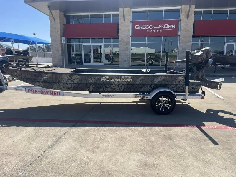 Slide: The Image of 2019 Pro-Line BTX 1848 boat on trailer, pre-owned, at Gregg Orr Marine dealership. - 2