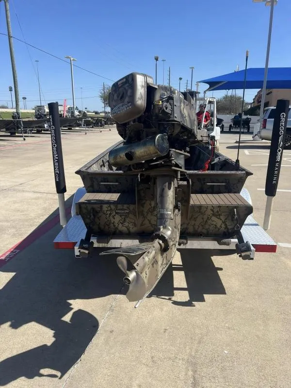 Slide: The Image of 2019 Pro-Line BTX 1848 boat with camouflage design on a trailer. - 4