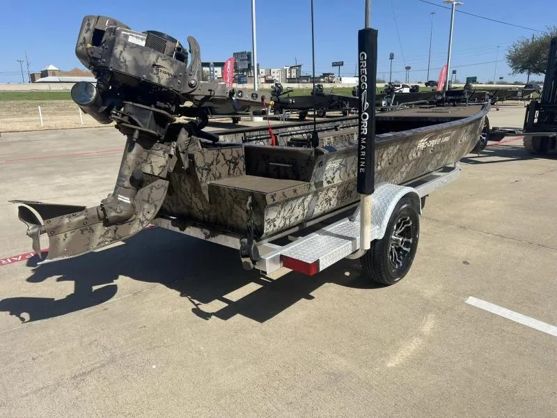 Slide: The Image of 2019 Pro-Line BTX 1848 boat on trailer, camo design, outdoor setting. - 5