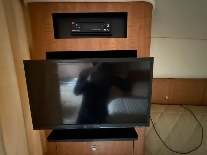 Slide: The Image of Interior of 2006 Sea Ray 320 Sundancer with TV and audio system. - 26