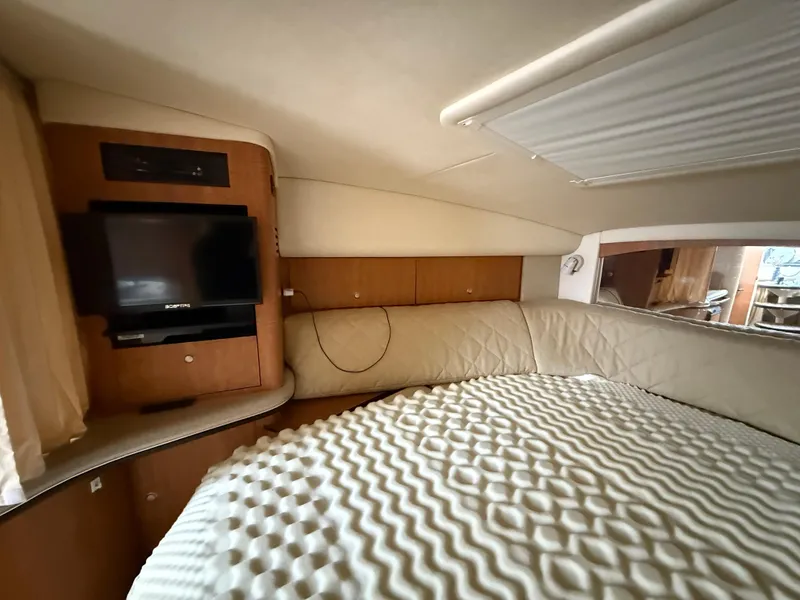 Slide: The Image of Interior cabin of 2006 Sea Ray 320 Sundancer with TV and cozy bed. - 27