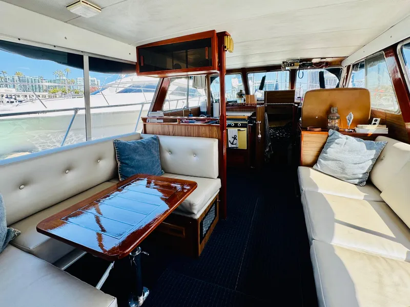 Slide: The Image of Interior of 1978 Tollycraft 30 Sedan with modern Cummins 6bt diesel motors, featuring elegant seating. - 11