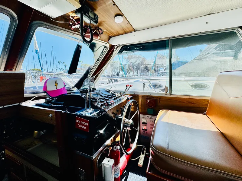 Slide: The Image of 1978 Tollycraft 30 Sedan helm with modern Cummins 6bt diesel motors, featuring classic interior design. - 17
