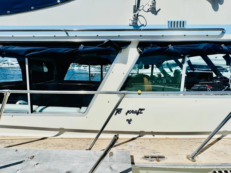 Slide: The Image of 1978 Tollycraft 30 Sedan with modern Cummins 6bt diesel motors, docked at marina. - 5