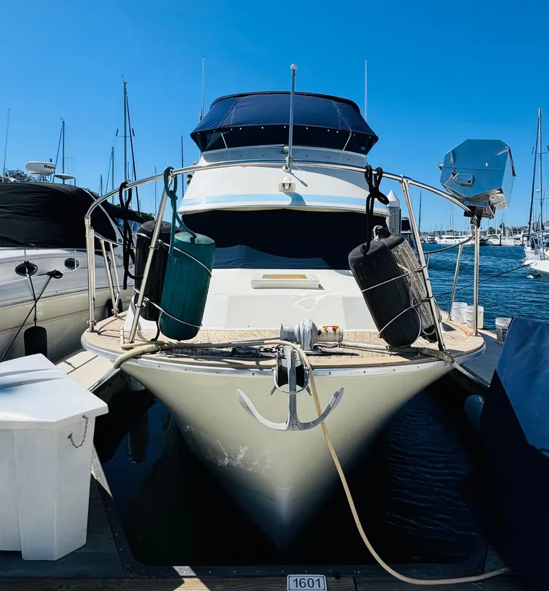 Slide: The Image of 1978 Tollycraft 30 Sedan with modern Cummins 6bt diesel motors docked at marina. - 8