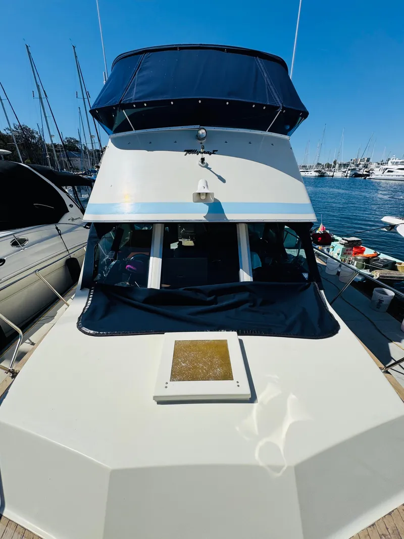 Slide: The Image of 1978 Tollycraft 30 Sedan with modern Cummins 6bt diesel motors, docked in a marina. - 9