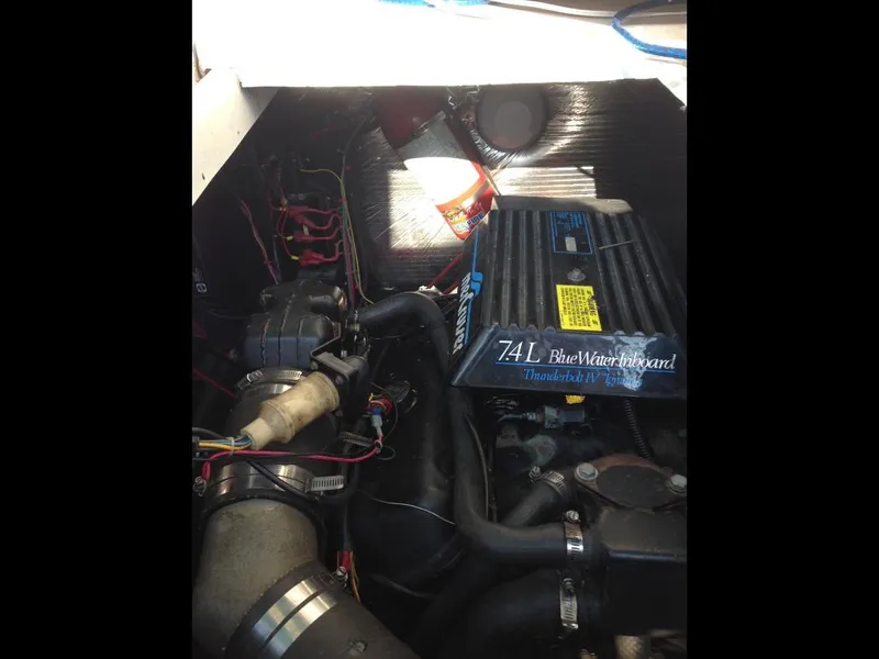 Slide: The Image of Engine compartment of a 1989 Regal Commodore 360 with 7.4L Blue Water engine. - 12