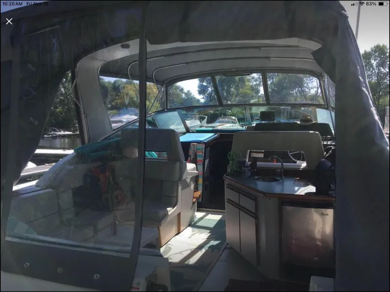 Slide: The Image of Interior view of 1989 Regal Commodore 360 boat with seating and kitchenette. - 17