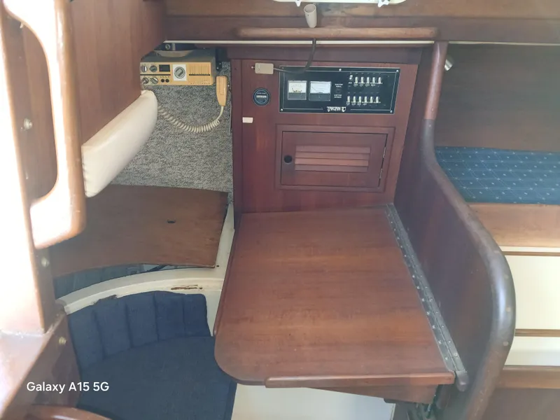 Slide: The Image of Interior of a 1981 Tartan 33 sailboat with wooden navigation station. - 4