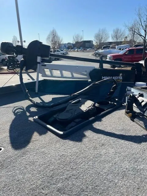 Slide: The Image of 2024 Ranger RT188 boat with Minn Kota trolling motor in a parking lot. - 8