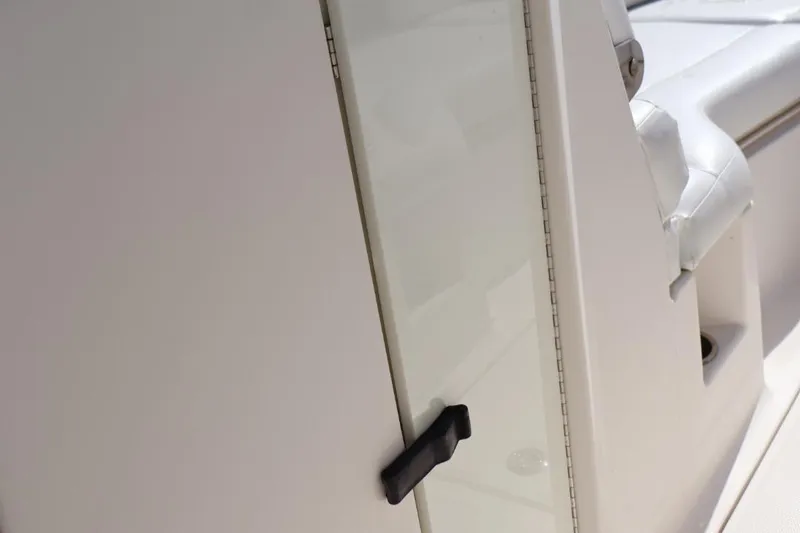 Slide: The Image of Sea Ray 270 Sundeck Outboard 2015, close-up of cabin door and seating area. - 13