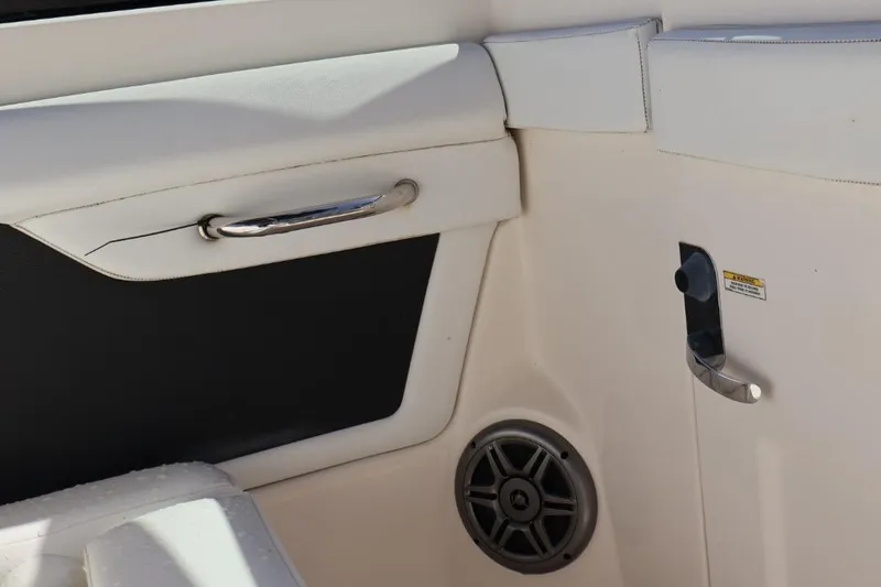 Slide: The Image of Interior detail of a 2015 Sea Ray 270 Sundeck Outboard boat, featuring a speaker and handle. - 14