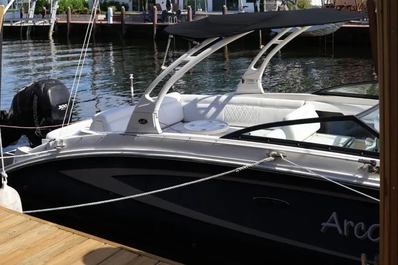 Slide: The Image of 2015 Sea Ray 270 Sundeck Outboard docked, featuring sleek design and comfortable seating. - 25