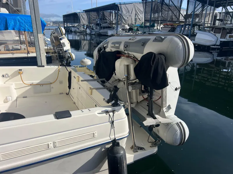 Slide: The Image of 2004 Bayliner 288 Ciara Classic Command Bridge docked with inflatable boat attached. - 37