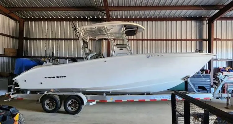 Slide: The Image of 2020 Cape Horn 27 XS boat on trailer in storage facility. - 1