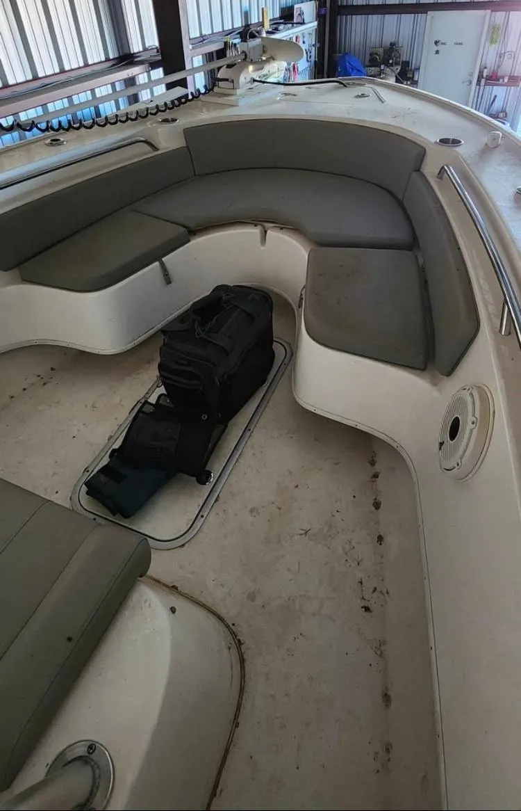 Slide: The Image of 2020 Cape Horn 27 XS boat interior with cushioned seating and storage bags. - 10