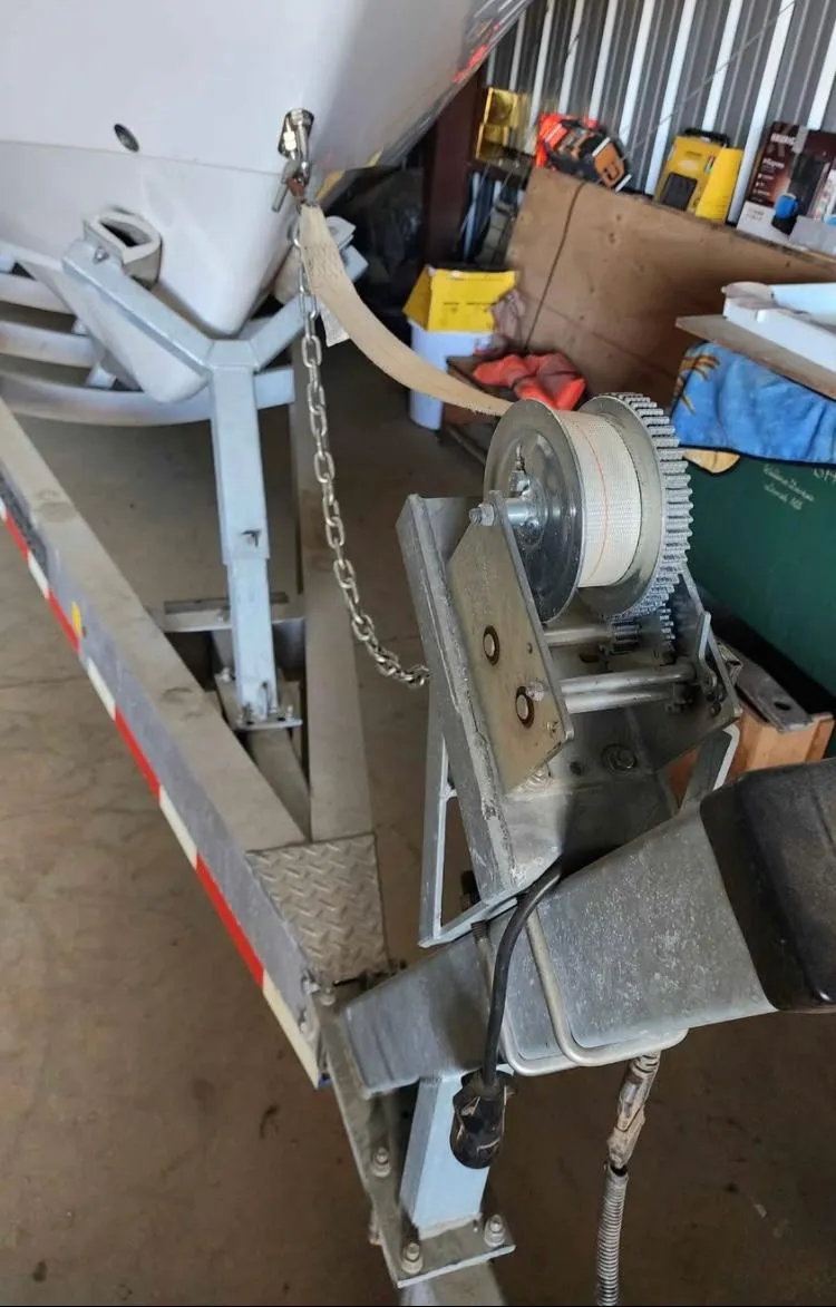 Slide: The Image of 2020 Cape Horn 27 XS boat on trailer with winch in a garage. - 12