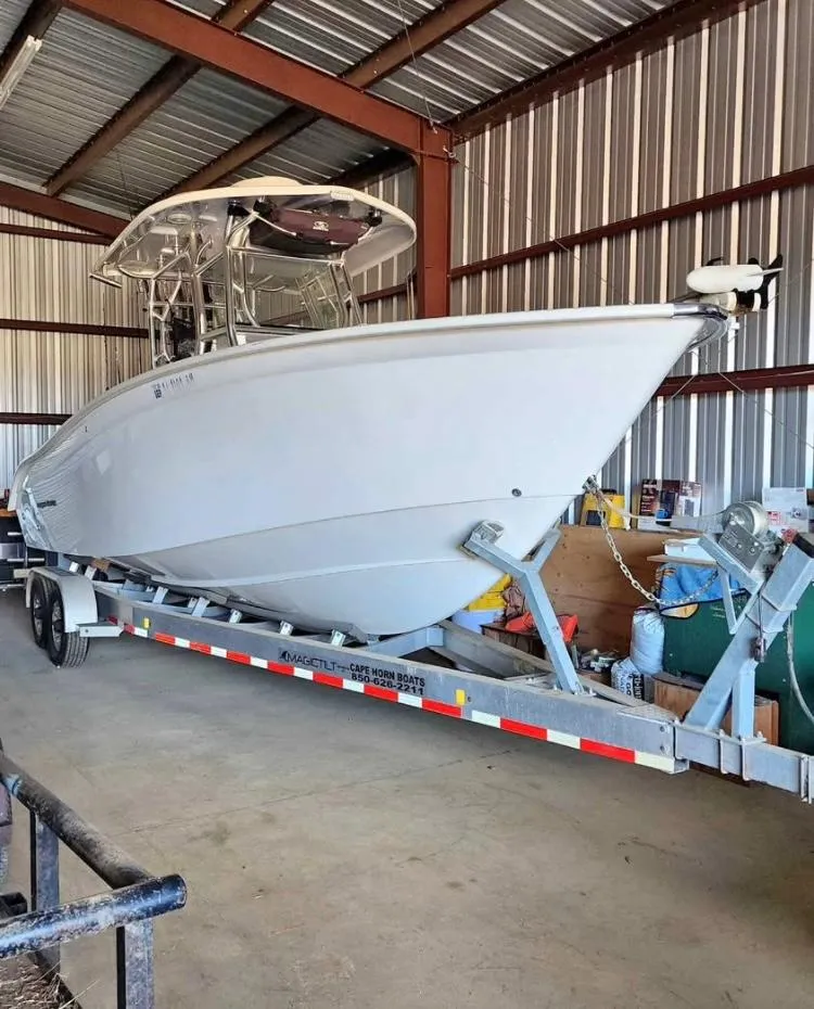 Slide: The Image of 2020 Cape Horn 27 XS boat on trailer in storage facility. - 2