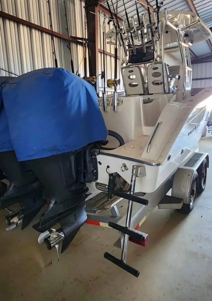 Slide: The Image of 2020 Cape Horn 27 XS boat with dual engines in a storage facility. - 4