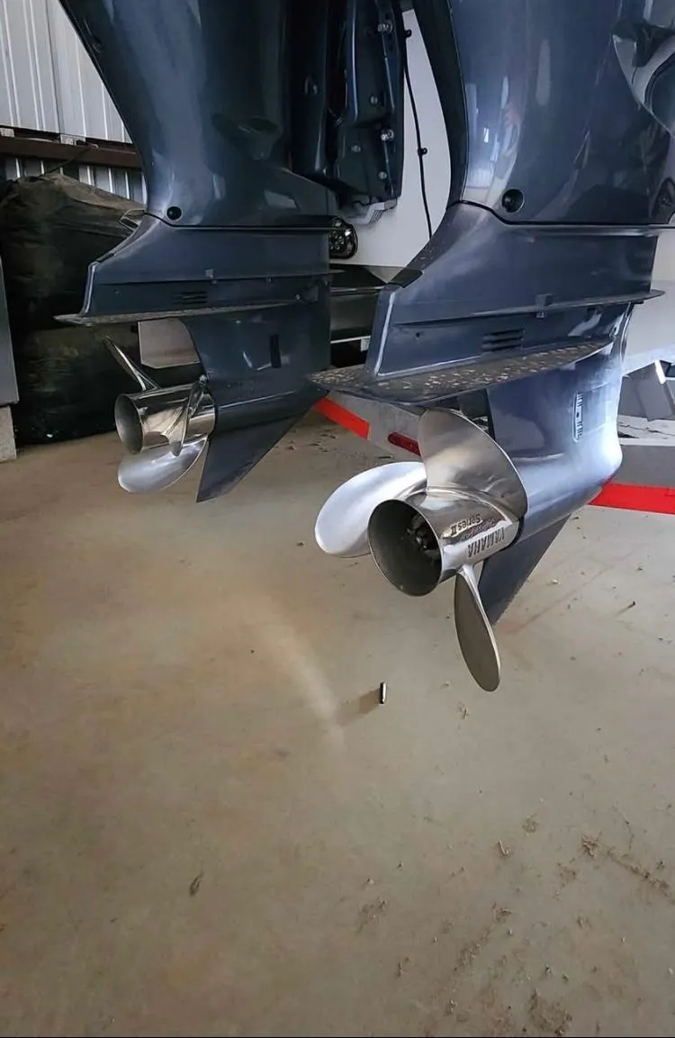 Slide: The Image of Dual outboard motors on a 2020 Cape Horn 27 XS boat in a garage. - 5