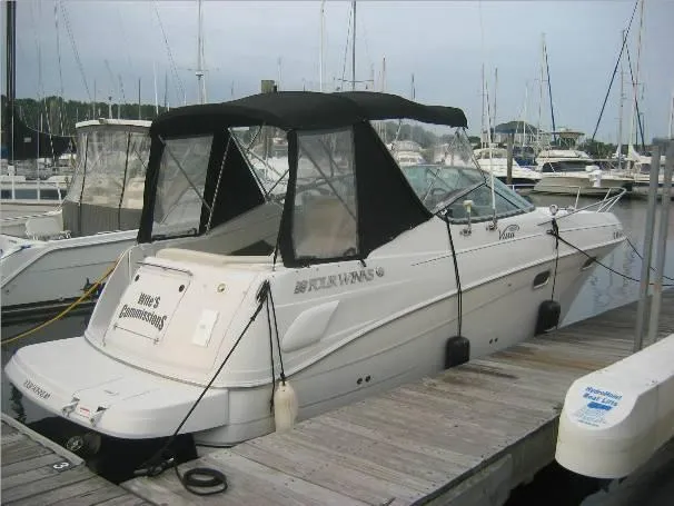 The Image of 2003 Four Winns 268 Vista boat docked at marina with black canopy. - 0