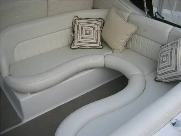 Slide: The Image of 2003 Four Winns 268 Vista boat interior with plush seating and decorative pillows. - 1