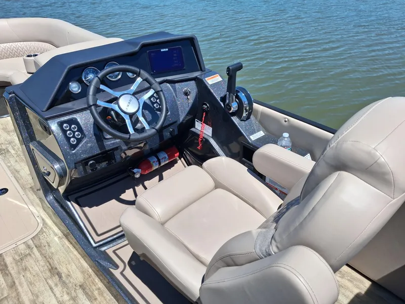 Slide: The Image of Cockpit of 2025 Crest Caribbean 230 SLRC on the water. - 9