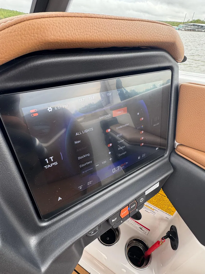 Slide: The Image of Touchscreen control panel in 2025 Tigé Z5 boat, displaying lighting and system settings. - 13