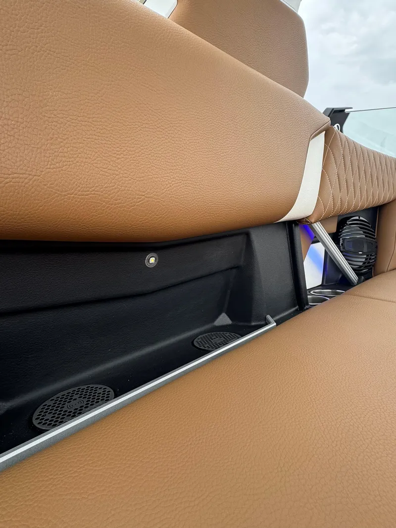Slide: The Image of 2025 Tigé Z5 boat interior with tan leather seating and sleek design elements. - 7
