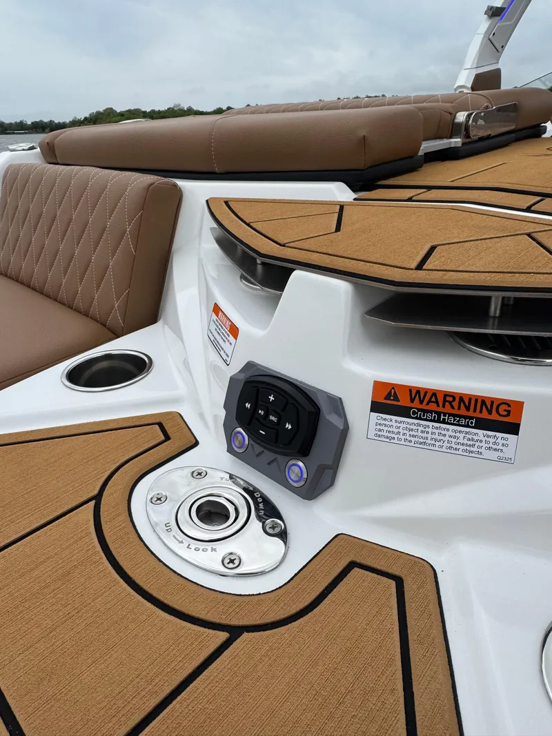 Slide: The Image of 2025 Tigé Z5 boat interior with tan upholstery and control panel. - 8