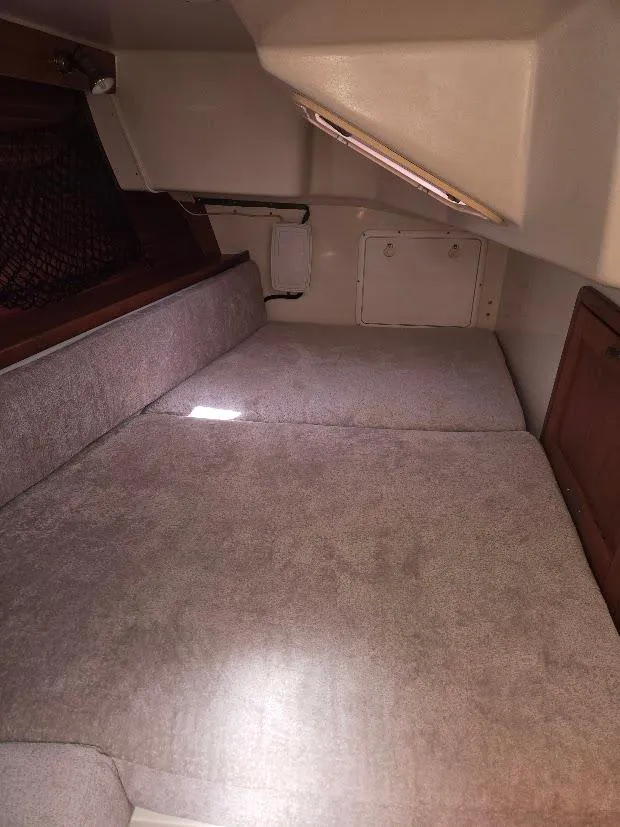 Slide: The Image of Interior cabin of a 1997 Catalina 42 MkII sailboat with cushioned seating. - 48