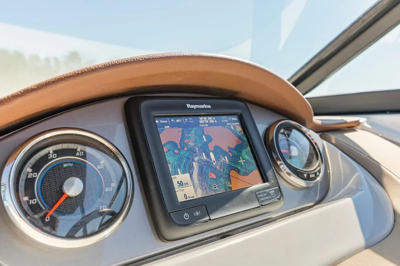 Slide: The Image of Dashboard of 2017 Sea Ray SDX 270 Outboard with navigation display and gauges. - 14