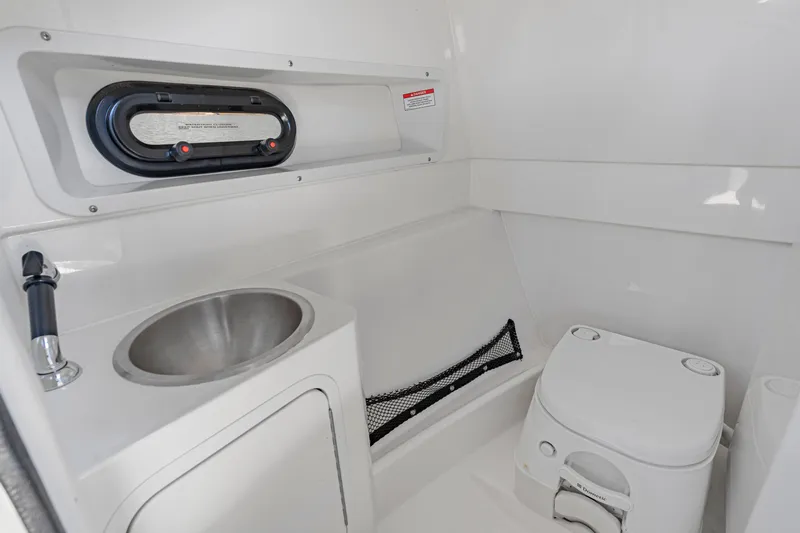 Slide: The Image of 2017 Sea Ray SDX 270 Outboard interior with sink and toilet. - 19